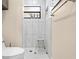 Updated bathroom features a sleek, tiled shower with a window, creating a refreshing space at 11318 Stoneybrook Path, Port Richey, FL 34668