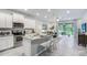 Modern eat-in kitchen with stainless appliances, granite counters and bright white cabinetry at 11408 Velvet Apricot Dr, Land O Lakes, FL 34638