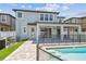 Relaxing backyard with a private pool, covered patio, and well-maintained landscaping, perfect for outdoor living at 11416 Alachua Creek Ln, Riverview, FL 33579