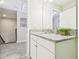 Bathroom showcasing a granite countertop and a view of the landing at the top of the stairs at 11416 Alachua Creek Ln, Riverview, FL 33579