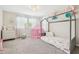Bright bedroom features a twin sized bed, soft carpet, and decor creating a comfortable and playful space at 11416 Alachua Creek Ln, Riverview, FL 33579