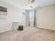 Bedroom with a ceiling fan, carpet, and a window with blinds and curtains at 11416 Alachua Creek Ln, Riverview, FL 33579