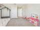 ' bedroom with soft carpet, play furniture, and a twin sized bed, creating a playful and inviting space at 11416 Alachua Creek Ln, Riverview, FL 33579
