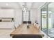Bright dining room with modern light fixture, sliding glass doors and access to the patio at 11416 Alachua Creek Ln, Riverview, FL 33579