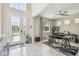 Bright foyer features tile floors, a glass paneled door and an office space with a ceiling fan at 11416 Alachua Creek Ln, Riverview, FL 33579