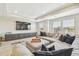 Upstairs bonus room with comfortable sectional and modern decor at 11416 Alachua Creek Ln, Riverview, FL 33579