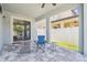 Covered patio featuring brick pavers with a ceiling fan and outdoor furniture at 11416 Alachua Creek Ln, Riverview, FL 33579
