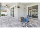 Covered patio featuring brick pavers with a ceiling fan and outdoor furniture at 11416 Alachua Creek Ln, Riverview, FL 33579