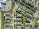 An aerial view showing neighborhood layout with houses, green spaces, and street configurations at 11525 Scarlet Ibis Pl, Riverview, FL 33569