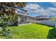 Great backyard featuring an outdoor covered patio and plenty of green space at 11525 Scarlet Ibis Pl, Riverview, FL 33569