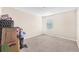 This cozy bedroom features neutral carpet, natural light, and plenty of space at 11525 Scarlet Ibis Pl, Riverview, FL 33569