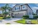 This beautiful two-story home features a large yard and an attached two-car garage at 11525 Scarlet Ibis Pl, Riverview, FL 33569