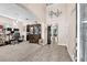Inviting foyer with a high ceiling, archways, and neutral decor, creating a warm entry at 11525 Scarlet Ibis Pl, Riverview, FL 33569