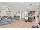 Bright and open-concept living room with hard surface flooring and modern furnishings at 11525 Scarlet Ibis Pl, Riverview, FL 33569