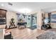 Cozy space with sliding glass doors to the backyard, a dining area, and natural wood floors at 11525 Scarlet Ibis Pl, Riverview, FL 33569