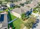 Aerial view of the home showing the rear exterior and a well-maintained lawn at 11525 Scarlet Ibis Pl, Riverview, FL 33569