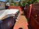 Backyard view of the empty above ground pool with a wooden deck at 11600 Crystal Lake Dr, Port Richey, FL 34668