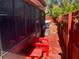 Backyard view of the exterior screened-in porch of this single-Gathering home at 11600 Crystal Lake Dr, Port Richey, FL 34668