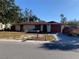 Charming single-story home featuring a well-kept lawn and a classic design at 11600 Crystal Lake Dr, Port Richey, FL 34668