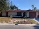 Charming single-story home featuring a well-kept lawn and a classic design at 11600 Crystal Lake Dr, Port Richey, FL 34668