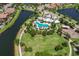 An aerial view of the community's resort-style pool, amenity center, and playground at 11909 Climbing Fern Ave, Riverview, FL 33579