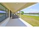 A cozy seating area on the covered lanai with views of the lake at 11909 Climbing Fern Ave, Riverview, FL 33579