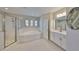 Bright bathroom featuring a tub, shower, and modern white vanity at 11909 Climbing Fern Ave, Riverview, FL 33579