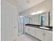 Bathroom featuring granite countertops, a glass-enclosed shower, and white vanity at 11909 Climbing Fern Ave, Riverview, FL 33579