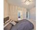 Bright bedroom with carpet and modern light fixture, with access to bathroom and hallway at 11909 Climbing Fern Ave, Riverview, FL 33579