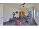 Home gym with a variety of equipment, wood sauna, and ample space for working out at 11909 Climbing Fern Ave, Riverview, FL 33579