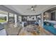 Cozy living room with view of kitchen and backyard with sliding glass doors, great for entertaining at 11909 Climbing Fern Ave, Riverview, FL 33579
