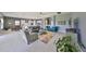 Expansive open concept living room offers comfortable seating, natural light, and open floor plan at 11909 Climbing Fern Ave, Riverview, FL 33579