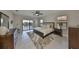 Large main bedroom with ceiling fan, balcony access and lake view at 11909 Climbing Fern Ave, Riverview, FL 33579