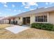 View of the home's backyard and patio area, with a sliding glass door entry at 1227 Tuxford Dr, Brandon, FL 33511