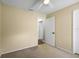 Bedroom featuring neutral carpet and a doorway to an adjacent room at 1227 Tuxford Dr, Brandon, FL 33511