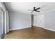 Bedroom features wood floors, ceiling fan, and closet, offering ample storage and natural light at 1227 Tuxford Dr, Brandon, FL 33511