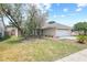 Charming home with stone accents, a well-maintained lawn, and a two-car garage at 1227 Tuxford Dr, Brandon, FL 33511