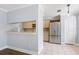 Kitchen featuring a breakfast bar that opens to the living room and stainless steel refrigerator at 1227 Tuxford Dr, Brandon, FL 33511