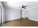 Spacious living area with wood floors, great natural light, and easy access to the hallway at 1227 Tuxford Dr, Brandon, FL 33511