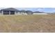 This expansive lawn provides generous space with views of the backyard and neighboring houses at 12572 Bergstrom Bay Dr, Riverview, FL 33579