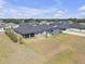 View of fenced-in backyard, and screen-enclosed swimming pool in neighboring lot at 12572 Bergstrom Bay Dr, Riverview, FL 33579
