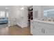 Bright bathroom featuring dual vanities and a walk-in closet at 12572 Bergstrom Bay Dr, Riverview, FL 33579