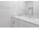 Modern bathroom featuring double sinks, white cabinets, and a large mirror at 12572 Bergstrom Bay Dr, Riverview, FL 33579