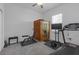 Spacious bedroom with a wooden sauna, a treadmill, and a window offering natural light at 12572 Bergstrom Bay Dr, Riverview, FL 33579