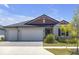 Attractive single-Gathering home with a well-manicured lawn and a two-car garage at 12572 Bergstrom Bay Dr, Riverview, FL 33579