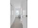 Hallway with carpet leading to a bedroom featuring clean lines, neutral tones and ample closet space at 12572 Bergstrom Bay Dr, Riverview, FL 33579