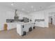 Bright open kitchen with modern appliances, a center island, and ample cabinet storage at 12572 Bergstrom Bay Dr, Riverview, FL 33579