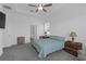 Large main bedroom featuring a tray ceiling, fan, and ensuite bathroom at 12572 Bergstrom Bay Dr, Riverview, FL 33579