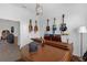 Music room with piano, guitars, tiled floors, and neutral paint at 12572 Bergstrom Bay Dr, Riverview, FL 33579