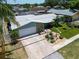 Aerial view of a home showing driveway, and tropical landscaping at 12965 Ridge Rd, Largo, FL 33778